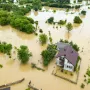 aerial-view-flooded-house-with-dirty-water-all-around-it.webp